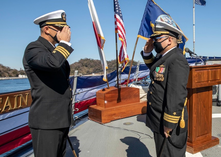 YOKOSUKA, Japan - Cmdr. Tin Tran, right, relieves Cmdr. Ryan T. Easterday as the commanding officer of the Arleigh Burke-class guided-missile destroyer John S. McCain (DDG 56). McCain is assigned to Destroyer Squadron Fifteen (DESRON 15), the Navy’s largest forward-deployed DESRON and the U.S. 7TH Fleet’s principal surface force. (U.S. Navy photo by Mass Communication Specialist Seaman Santiago Navarro)
